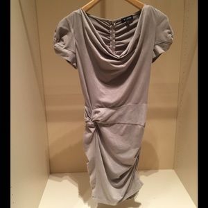 NWOT flattering and sexy tan suede Bebe dress